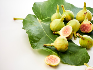 Figs fruit with leaves on white background