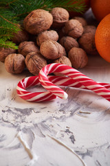 Chocolate, orange and nuts on table on white background. concept of new year