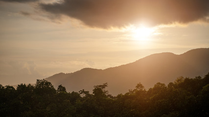 Rain on the mountains with warm light.