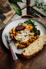 Warm hearty breakfast, lunch with organic farm curry veggies. Wood table. Slow food living concept, close up, food photography from above