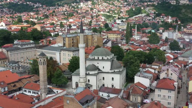 Drone shot Old watch tower and Gazi Husrev Baymosque from Ottoman period in the old part of Sarajevo Called "Bascarsija", Sarajevo, Bosnia an Herzegovina February 2019