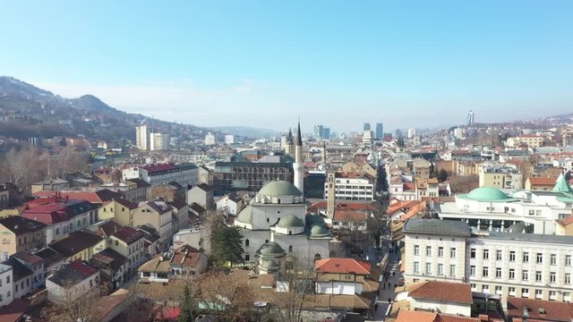 Drone shot Old watch tower and Gazi Husrev Baymosque from Ottoman period in the old part of Sarajevo Called "Bascarsija", Sarajevo, Bosnia an Herzegovina February 2019