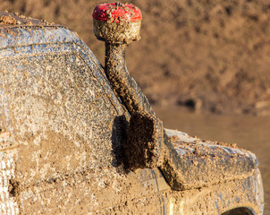 Mirror on a car in the mud