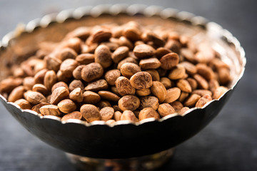 Indian charoly / Buchanania lanzan / Almondette kernel seeds in a bowl or pile. selective focus