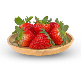 Strawberry in wooden plate isolated on white background