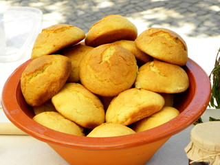 round yellow cookies in a clay bowl
