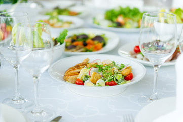 Fototapeta na wymiar salad on a white table in a restaurant
