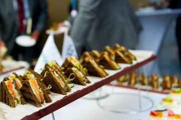 brown bread snacks on a buffet table. selective focus
