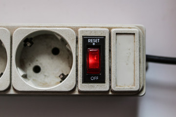 Button to turn off the network filter. Electrical device with sockets
