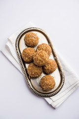 Jaggery coconut Laddoo / Nariyal gur ke laddu, indian sweet food for festivals like rakshabandhan/rakhi pournima