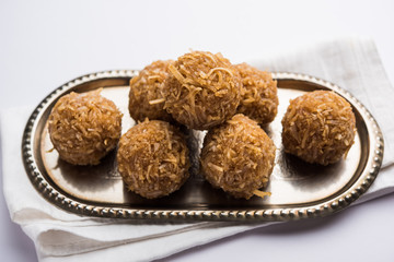 Jaggery coconut Laddoo / Nariyal gur ke laddu, indian sweet food for festivals like rakshabandhan/rakhi pournima