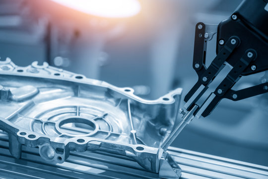 The operation of robotics arm in automotive parts production line for quality control process. The hi-technology automotive parts manufacturing process by robotic arm.