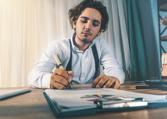 Fototapeta premium young business man is signing the deal