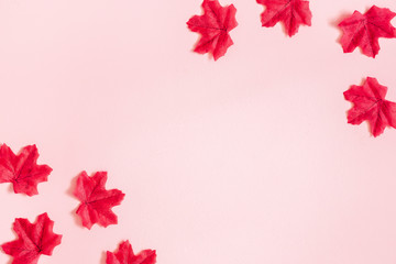 Autumn composition. Maple leaves on pink background. Autumn, fall, thanksgiving day concept. Flat...