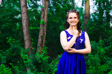 beautiful girl in long dress in the forest