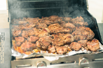 Cooking meat on the grill. The process of making grilled meat. Juicy and fresh meat on the grill