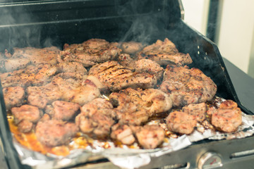 Cooking meat on the grill. The process of making grilled meat. Juicy and fresh meat on the grill