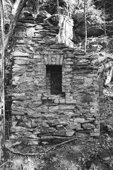 old ruin of stone in black and white