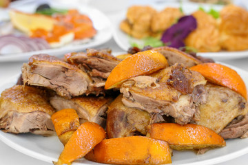 Caramelized duck with oranges. Cocktail party. A restaurant.
