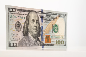 100 dollar bill shot from angle