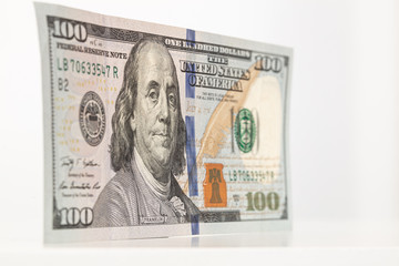 100 dollar bill shot from angle