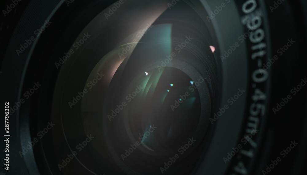 Poster close up beautiful camera lens with color reflection background.