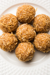 Jaggery coconut Laddoo / Nariyal gur ke laddu, indian sweet food for festivals like rakshabandhan/rakhi pournima