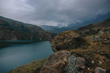 the lake is located deep in the mountains in cloudy weather.