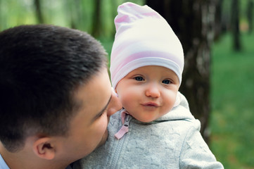 Сhild in dad's arms