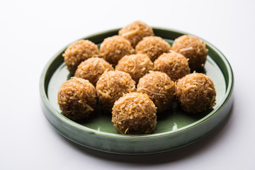 Jaggery coconut Laddoo / Nariyal gur ke laddu, indian sweet food for festivals like rakshabandhan/rakhi pournima
