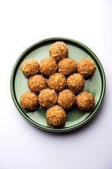 Jaggery coconut Laddoo / Nariyal gur ke laddu, indian sweet food for festivals like rakshabandhan/rakhi pournima