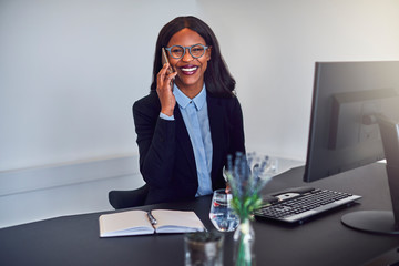 Young African American businesswoman talking on her cellphone at