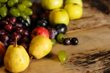 ripe fruits on the wooden table