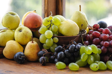 Pile ripe fruits on the windowsill