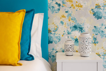 Modern Nightstand With Lamps and bright pillows