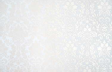 Beautiful texture of paper Wallpaper embossed in form of a classic floral ornament in light golden beige and white tones. - obrazy, fototapety, plakaty