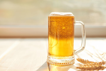 Oktoberfest beer. Glass beer mugs full of golden lager with thick frothy heads conceptual of  Oktoberfest. Beer mug. Big glass of lager beer from Bavaria and Munich Oktoberfest. Festival and Brewery