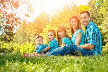 Fototapeta premium happy family outdoors in the park