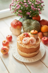 Naked Cake with Apples. Thanksgiving Day table. Happy Halloween Pumpkins, apples and flowers. Bright autumn background. Colorful autumn card. Autumn flower arrangement. Autumn bouquet