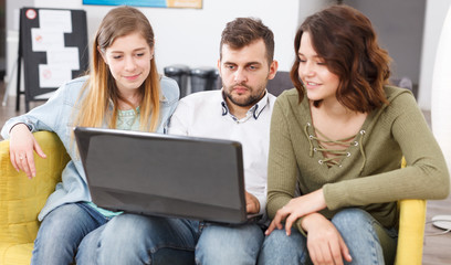 Young travelers with laptop