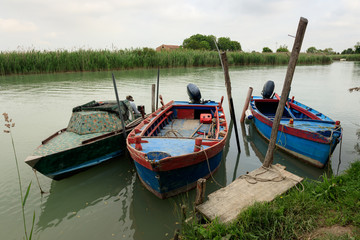 Fototapeta na wymiar fishing boats moored in the lagoon after fishing