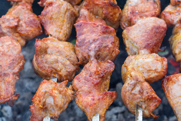 grilled meat over charcoal skewers
