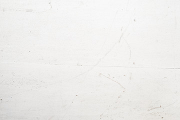 Modern worn grungy white colored wood with scratches and texture