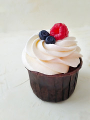 Isolated cupcake with cherry