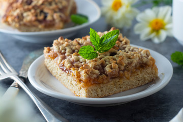 Crumble fruit pie, slice. Homemade cake with fruit jam. Delicious desert.