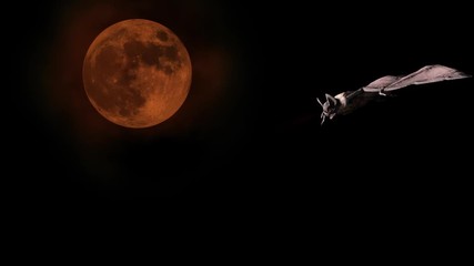 Vampire bat flying and attacking in the background of a blood red moon. Halloween concept.
