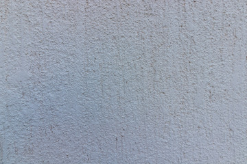 white plaster facade roughly trimmed