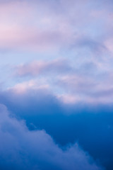 Naklejka na ściany i meble Dark beautiful clouds at sunrise closeup