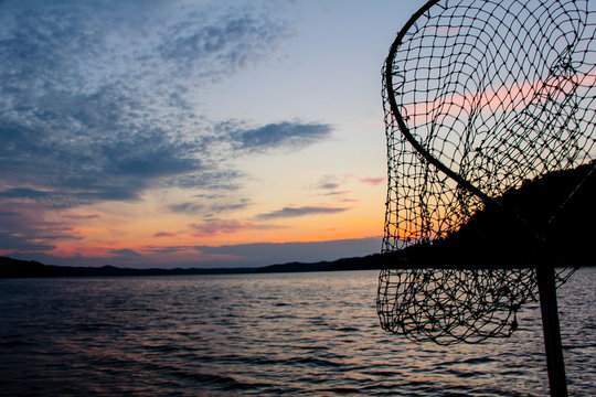 Fishing on a Lake at Sunrise