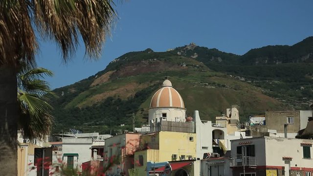 Panorama of the town of Forio d'Ischia, near Naples. Dome of the church of San Gaetano. The mountain and the blue sky.